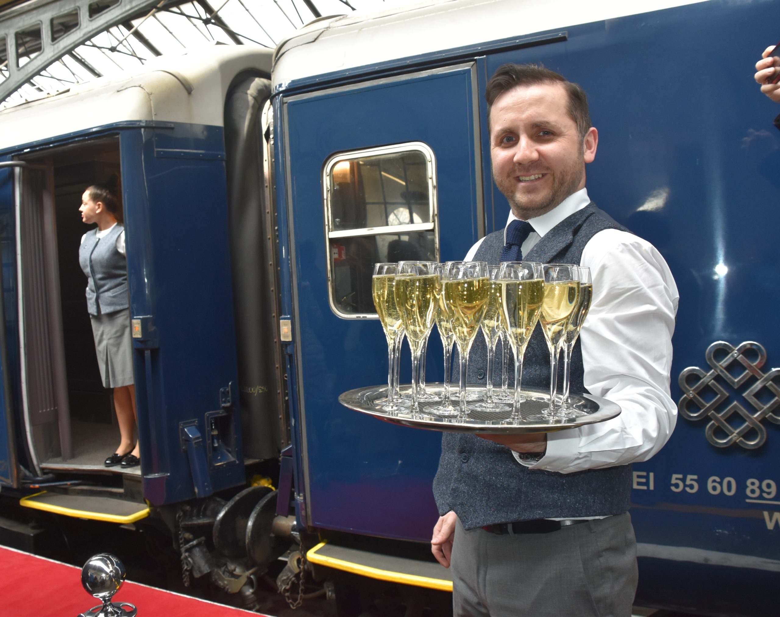 Server with champagne_outside_train.jpg
