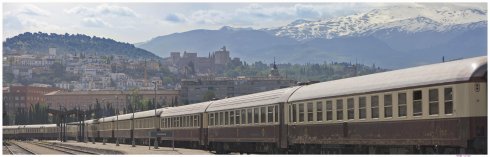 Al Andalus in Granada Station. The Alhambra is just visible on the hill behind the train.