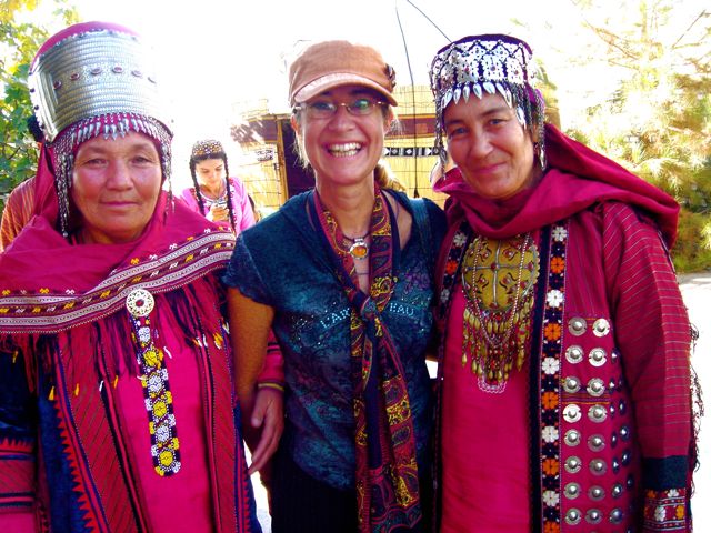 DSC02879_2 Village luncheon hosts near Mary, Turkmenistan flank the author. Photo © Chris Card Fuller