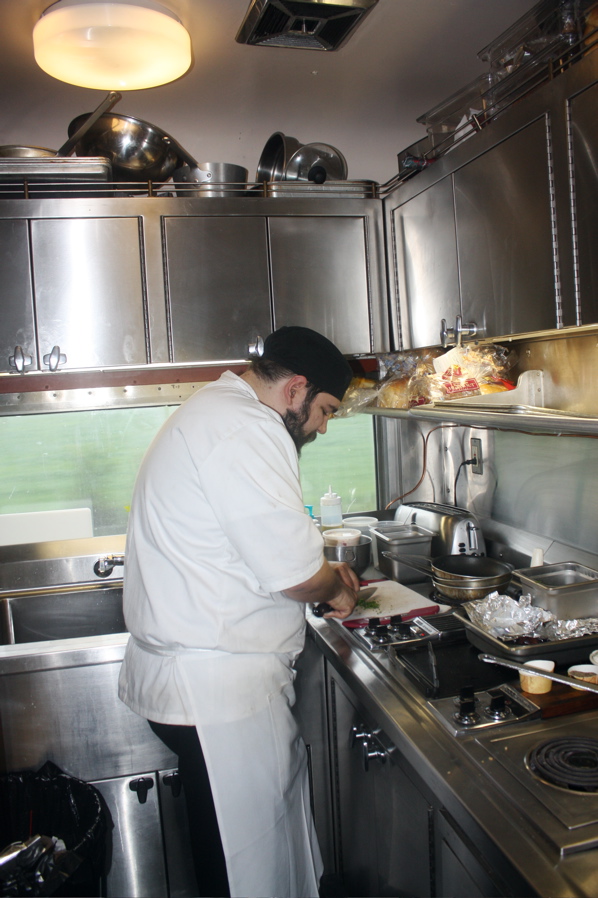 Chef somebody or other prepares the evening meal. IRT photo by Zane Katsikis