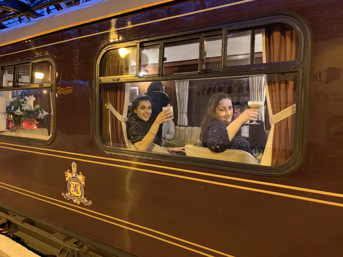 Toasting from observation car of Belmond Royal Scotsman.