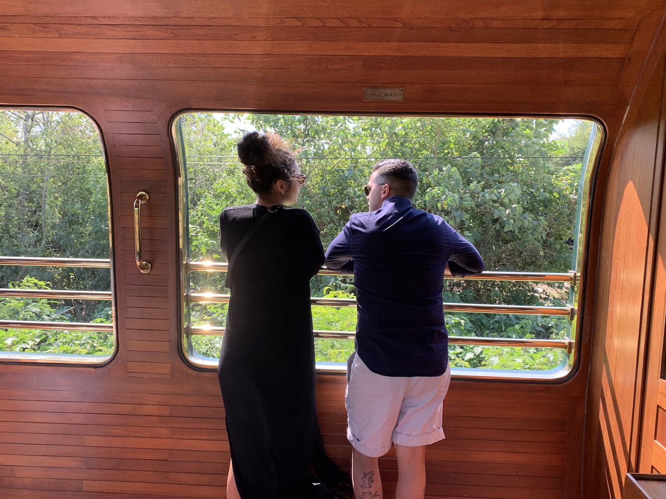 Couple on observation car of Eastern & Oriental Express