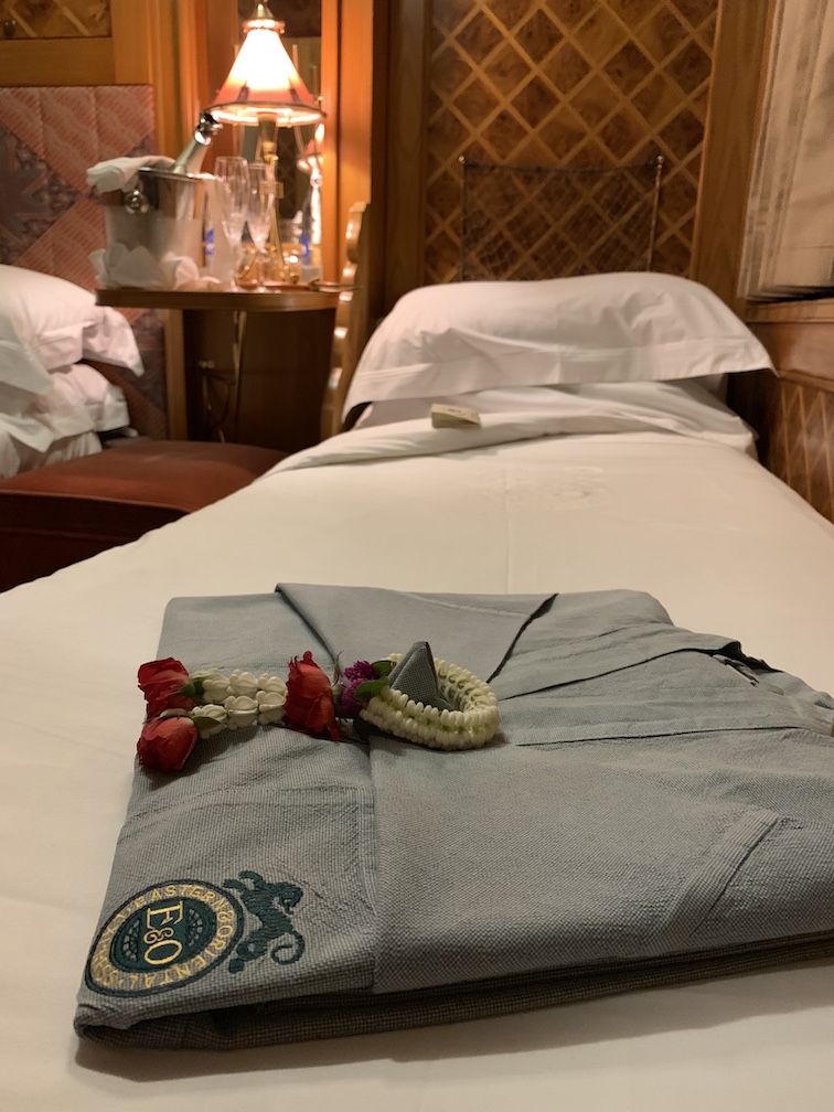 Robe on bed of Eastern & Oriental Express