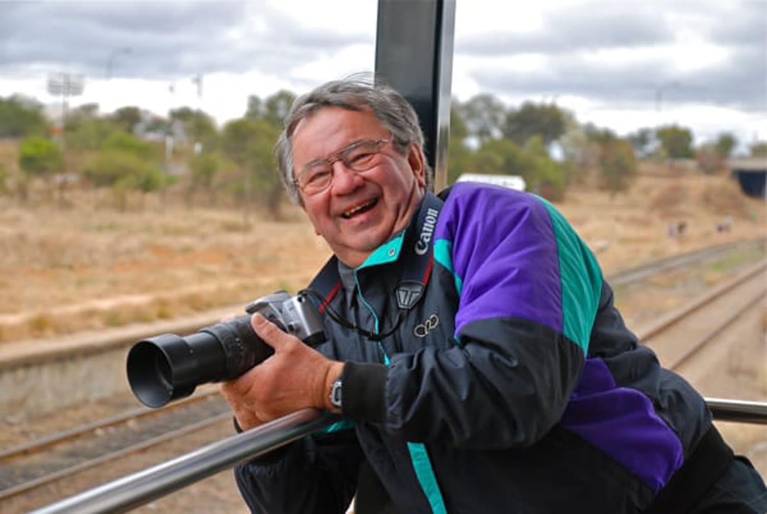 Guest with a camera on the Rovos Rail African Golf Safari journey