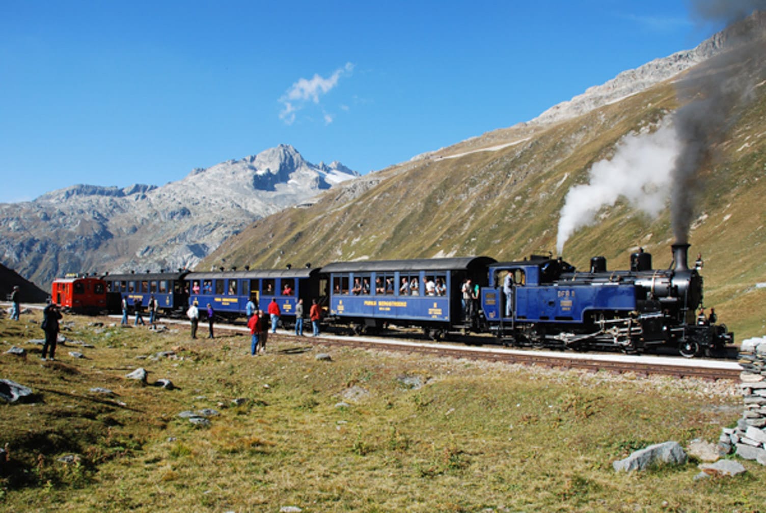 Train going up mountain on the Switzerland’s Classic Trains journey