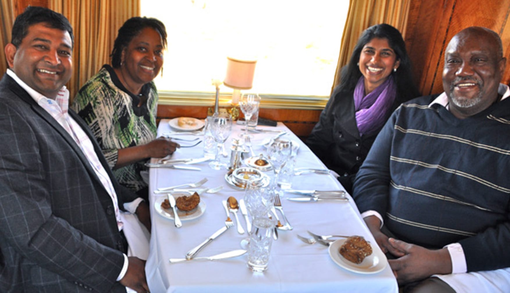 Friends eating on the The Blue Train: South Africa Luxury Train & Safaris journey