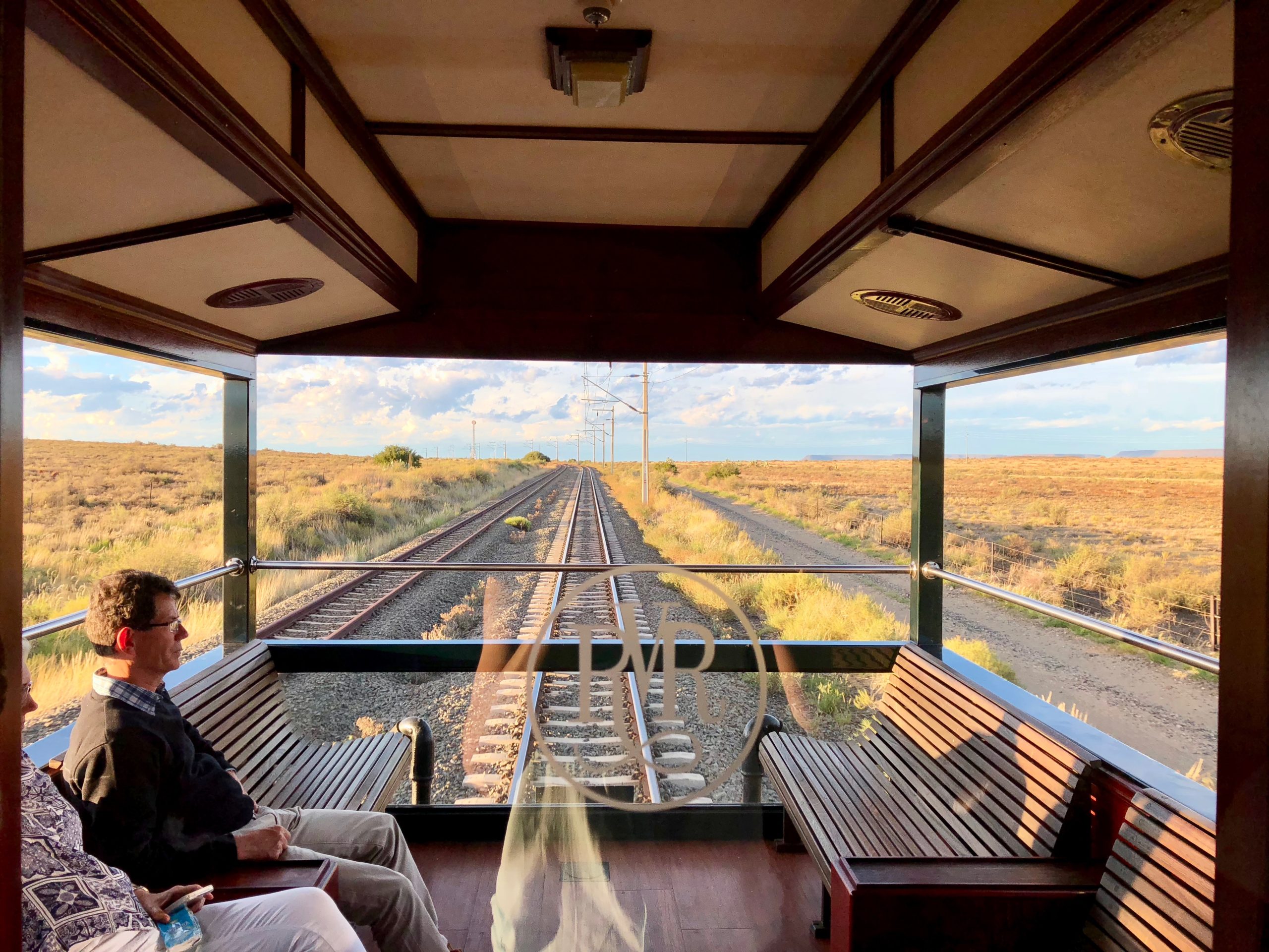 Observation car through glass with Rovos insignia.jpg