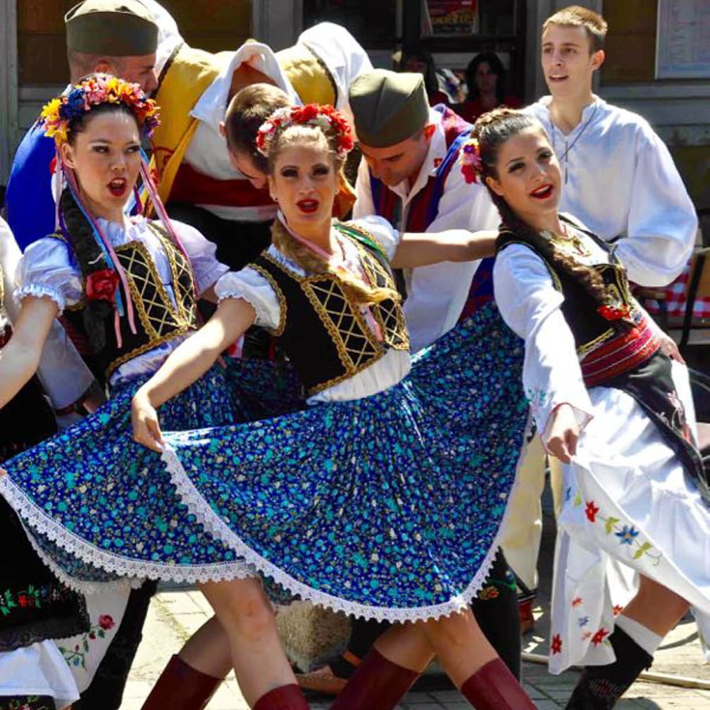 Women dancing in traditional costume on the Balkan Explorer on the Danube Express: Venice to Istanbul journey