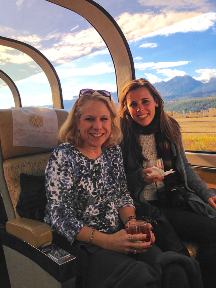 two women smiling on the Rocky Mountaineer: Ultra-Luxe Canadian Rockies Adventure journey