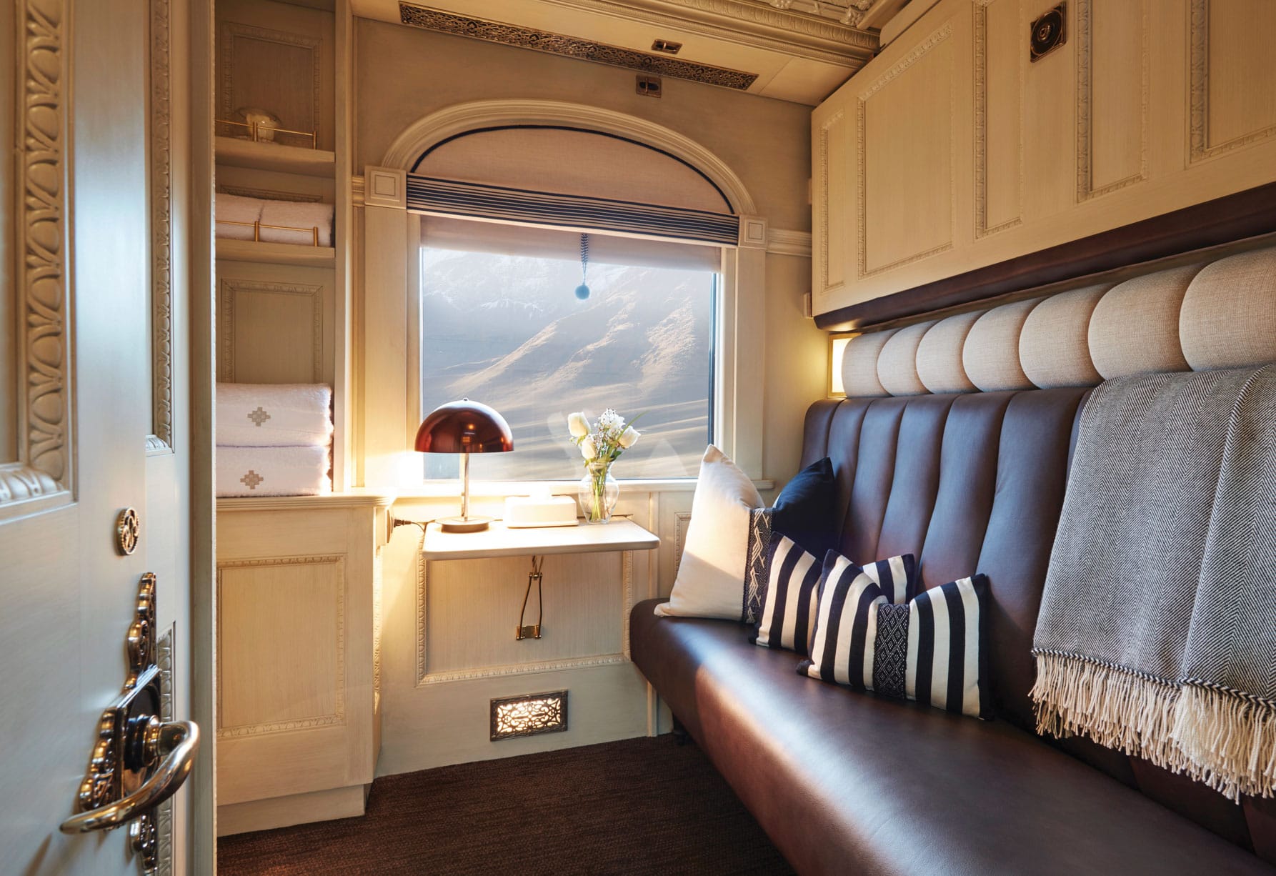 Twin bed and couch on the Belmond Andean Explorer train