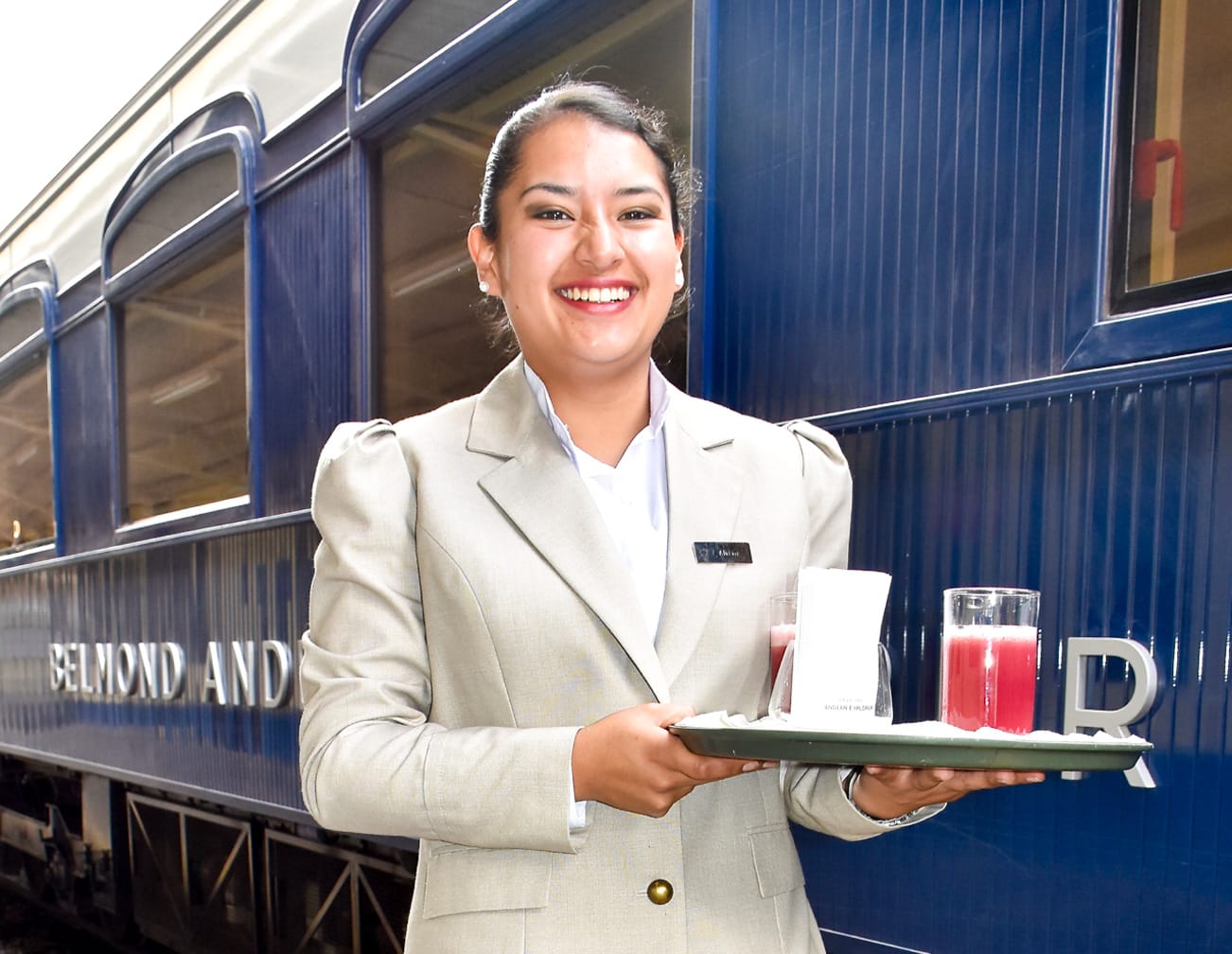 Server with drinks on the Belmond Andean Explorer