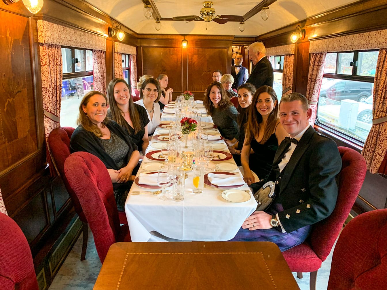 Guests eating dinner on the Belmond Royal Scotsman train