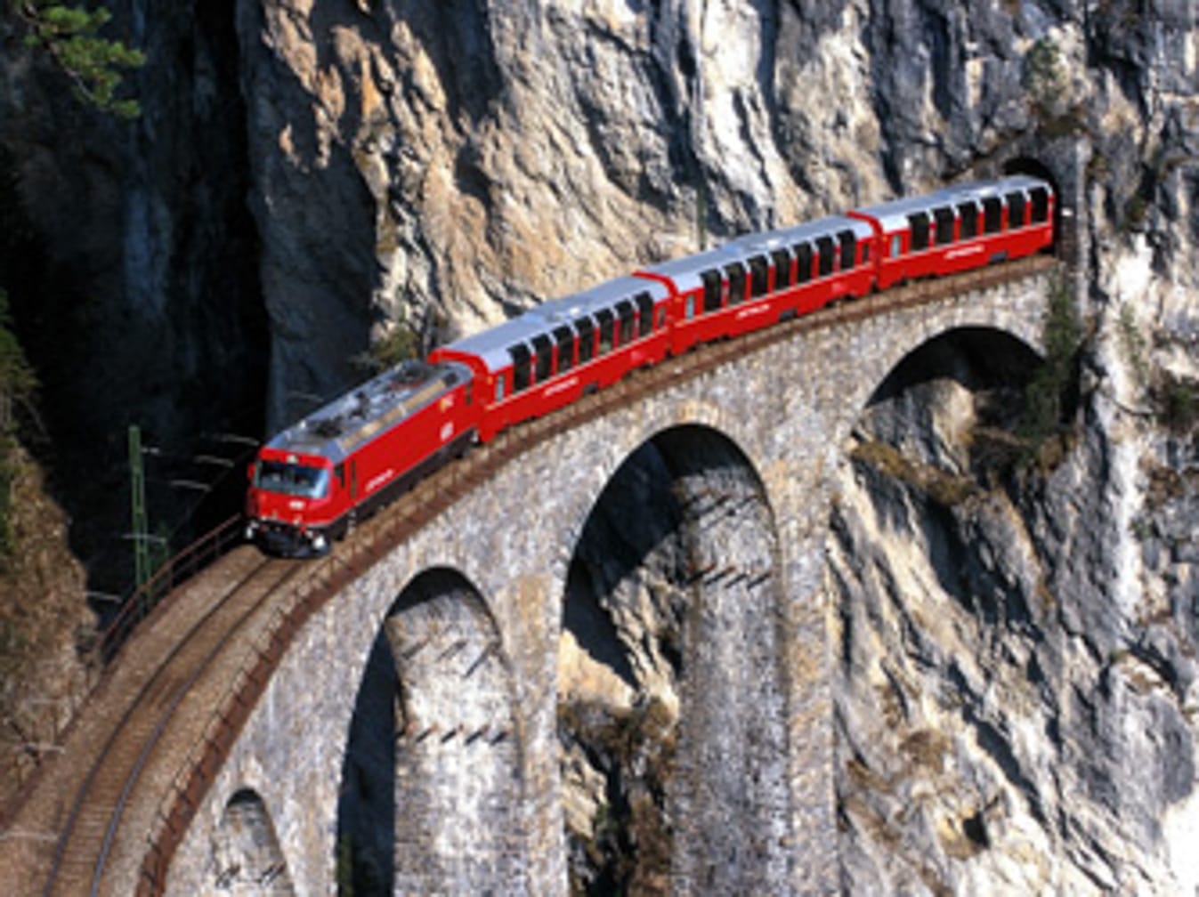 The Bernina Express in the Montebellocurve near Morteratsch. (Photo: Rhaetische Bahn; swiss-image.ch/Peter Donatsch)