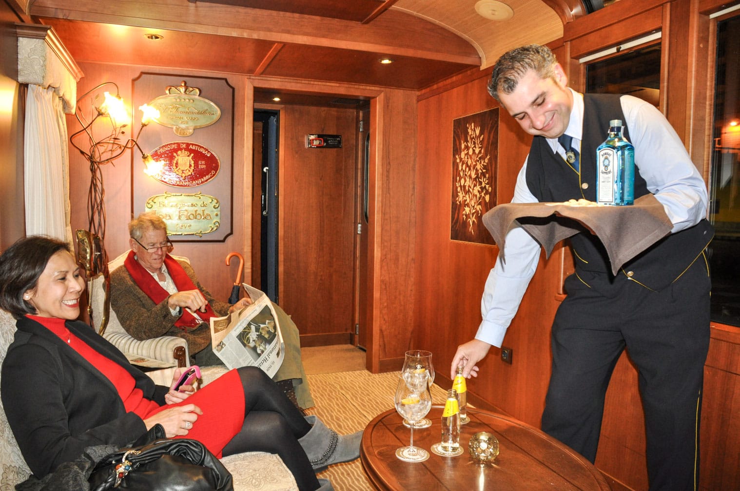 Bartender serving drinks on the El Transcantábrico Gran Lujo train