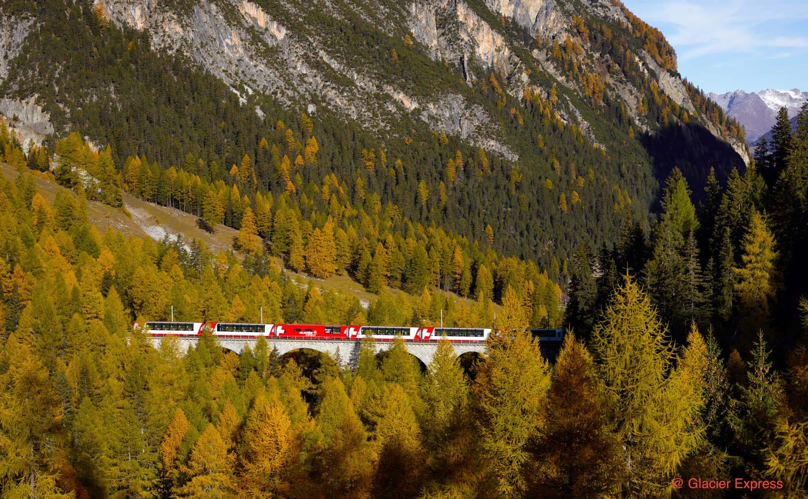 Glacier Express train going through mountains