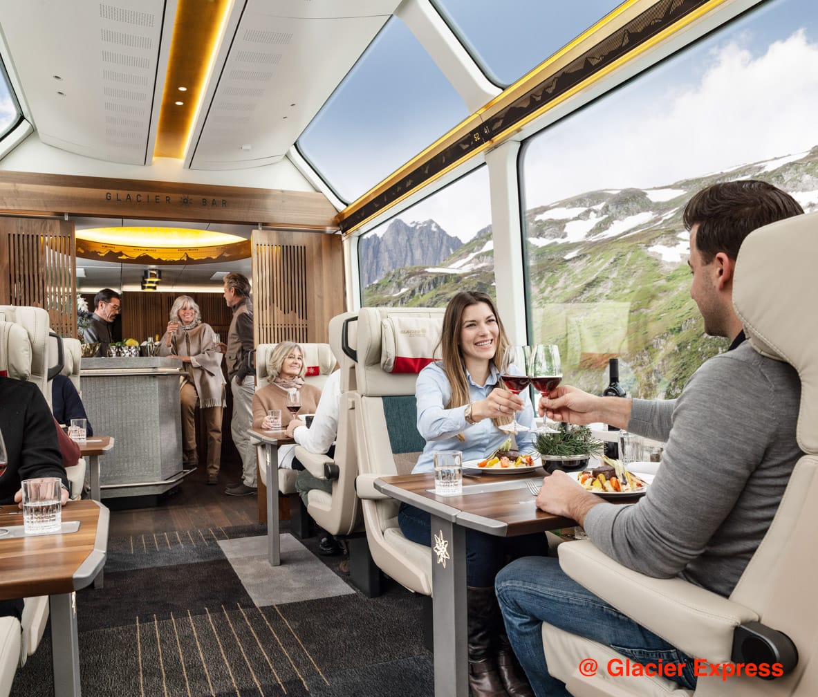 Guests drinking wine on the Glacier Express train