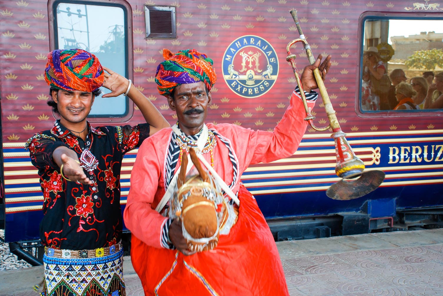 Two Indian dancers with instruments on the Maharajas’ Express train