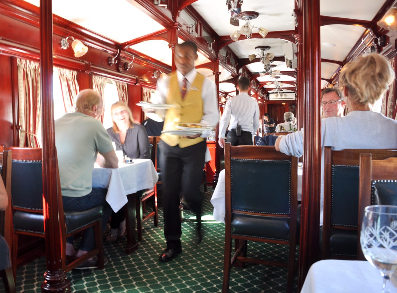 Server carrying food on the Rovos Rail Pride of Africa train