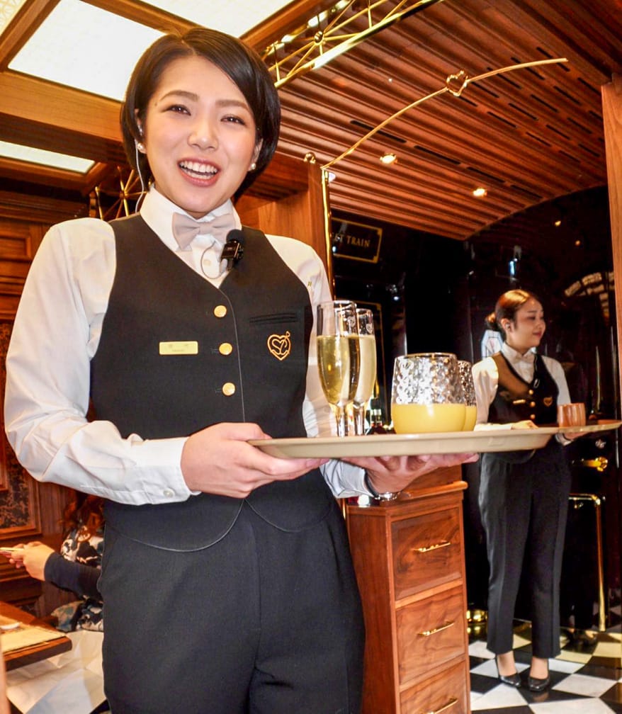 Server with drinks on The Sweet Train