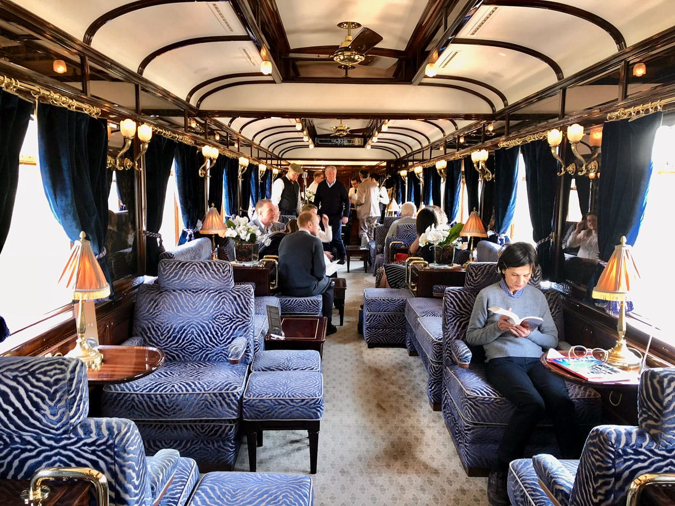 Guests reading in the Venice Simplon-Orient-Express (VSOE) train