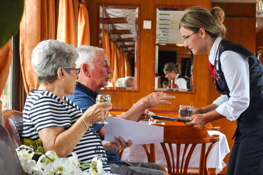 Guests enjoying the lounge car on the Golden Eagle Danube Express.