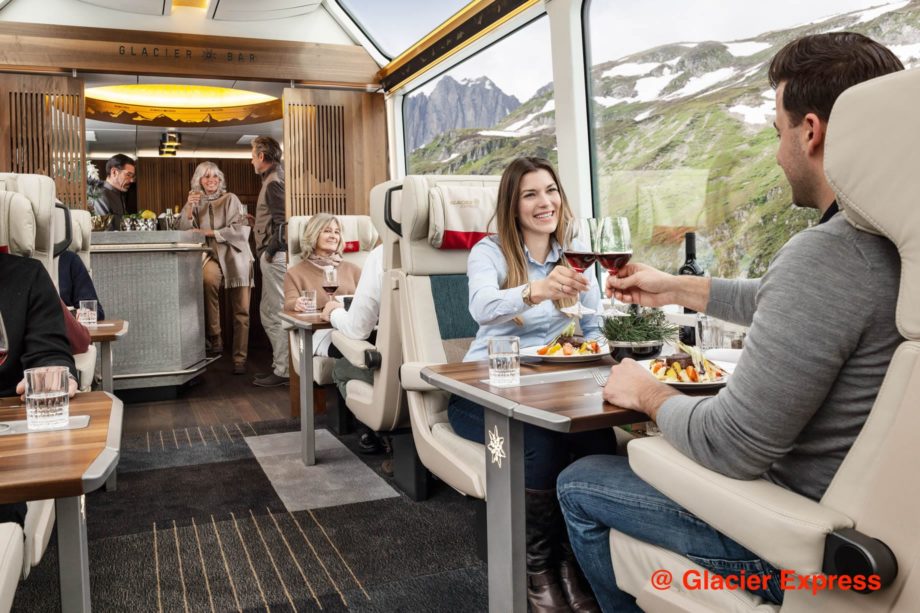 Guests drinking wine on the Glacier Express train