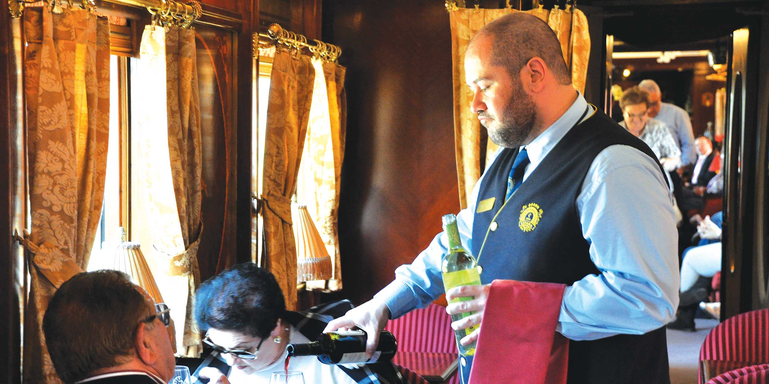 Server pours wine on the XYZ Train